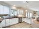 A bright kitchen with white cabinets, stainless steel dishwasher, and granite countertops at 1865 Berkeley Mews Ne, Atlanta, GA 30329