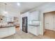 Bright kitchen featuring stainless steel refrigerator and open access to a living area at 1865 Berkeley Mews Ne, Atlanta, GA 30329