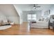 Spacious main bedroom with hardwood floors, white walls, ceiling fan, and sitting area at 1865 Berkeley Mews Ne, Atlanta, GA 30329