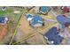 Aerial view of a beautiful home with a large backyard in a quiet, residential neighborhood at 2860 Chardonnay Ln, Cumming, GA 30041