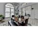 Dining room featuring modern lighting, windows, and glass french doors to office at 2860 Chardonnay Ln, Cumming, GA 30041