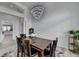 Bright dining room with modern chandelier and views into open floor plan at 2860 Chardonnay Ln, Cumming, GA 30041