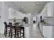 Kitchen with white cabinets, granite countertops, an island with bar seating, and stainless steel appliances at 2860 Chardonnay Ln, Cumming, GA 30041