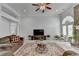 Large living room with plenty of space, a ceiling fan, hardwood floors, and natural light at 2860 Chardonnay Ln, Cumming, GA 30041