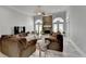 Spacious living room with stone fireplace, large windows, ceiling fan and hardwood floors at 2860 Chardonnay Ln, Cumming, GA 30041