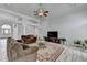 Open living room with high ceilings, ceiling fan, hardwood floors, and lots of natural light at 2860 Chardonnay Ln, Cumming, GA 30041