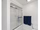 Bathroom featuring a sliding glass door, a white tiled bathtub, and a modern toilet at 3154 Chamblee Tucker Rd, Atlanta, GA 30341