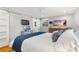 Bedroom with view into the Primary bath, hardwood floors, and light gray walls at 3154 Chamblee Tucker Rd, Atlanta, GA 30341