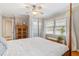 Bedroom with hardwood floors, bright windows, a ceiling fan, and natural light at 3154 Chamblee Tucker Rd, Atlanta, GA 30341