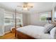 Bedroom with hardwood floors, bright windows, a ceiling fan, and natural light at 3154 Chamblee Tucker Rd, Atlanta, GA 30341