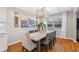 Elegant dining room with a large painting and a modern chandelier at 3154 Chamblee Tucker Rd, Atlanta, GA 30341