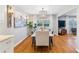 Elegant dining room with hardwood floors featuring a view into the living room at 3154 Chamblee Tucker Rd, Atlanta, GA 30341