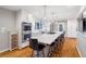 Bright kitchen featuring a large island with marble countertop, hardwood floors, and pendant lighting at 3154 Chamblee Tucker Rd, Atlanta, GA 30341