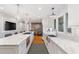 Spacious kitchen with a large island, white cabinets, and stainless steel appliances at 3154 Chamblee Tucker Rd, Atlanta, GA 30341