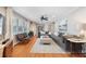 Well lit Living room featuring hardwood floors, a ceiling fan and a dining room at 3154 Chamblee Tucker Rd, Atlanta, GA 30341