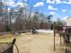 Spacious backyard featuring a deck, play set, partial fencing, and ample room for outdoor activities at 6124 Locklear Way, Douglasville, GA 30134