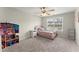 Bedroom featuring carpet, window, and a dollhouse at 6124 Locklear Way, Douglasville, GA 30134