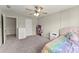 Comfortable bedroom with carpet, ceiling fan, and walk-in closet at 6124 Locklear Way, Douglasville, GA 30134