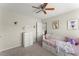 Cozy bedroom with a trundle bed, plush carpet, and charming decor at 6124 Locklear Way, Douglasville, GA 30134