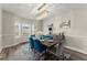 Elegant dining room featuring modern chandelier, stylish table setting, and hardwood flooring at 6124 Locklear Way, Douglasville, GA 30134