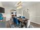 Elegant dining room featuring modern chandelier, stylish table setting, and hardwood flooring at 6124 Locklear Way, Douglasville, GA 30134