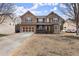 Charming two-story brick home with a welcoming front porch and well-maintained front yard on a sunny day at 6124 Locklear Way, Douglasville, GA 30134