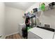 A utilitarian laundry room featuring a washer, dryer, and ample storage shelves at 6124 Locklear Way, Douglasville, GA 30134