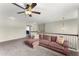 Cozy loft area featuring a comfortable sofa and neutral carpet at 6124 Locklear Way, Douglasville, GA 30134