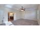 Bright main bedroom boasts tray ceilings, a ceiling fan, and an ensuite bathroom at 6515 Bentley Ridge Dr, Cumming, GA 30040