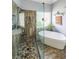 Contemporary bathroom features a walk-in shower and a soaking tub by a sunny window at 2678 Neighborhood S Walk, Villa Rica, GA 30180