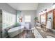 Contemporary bathroom featuring a soaking tub, glass shower, double vanity, and modern fixtures at 2678 Neighborhood S Walk, Villa Rica, GA 30180