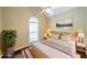 Stylishly staged bedroom with a neutral color palette and a light wood frame bed at 2678 Neighborhood S Walk, Villa Rica, GA 30180