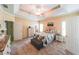 Spacious bedroom featuring tray ceilings, carpeted floors, and neutral paint at 2678 Neighborhood S Walk, Villa Rica, GA 30180