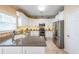 Modern kitchen featuring granite countertops, stainless steel appliances, and white cabinets at 2678 Neighborhood S Walk, Villa Rica, GA 30180