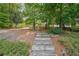 A serene, wooded pathway with rustic steps leading to a secluded and peaceful area at 2678 Neighborhood S Walk, Villa Rica, GA 30180