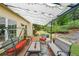 Covered patio area with outdoor seating, porch swing, and manicured backyard at 2678 Neighborhood S Walk, Villa Rica, GA 30180