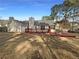Large backyard features a deck, fire pit, and privacy fence at 3151 Victoria Place Dr, Loganville, GA 30052