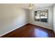 Bedroom featuring hardwood floors and a large window at 3151 Victoria Place Dr, Loganville, GA 30052