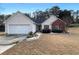 Charming single-Gathering home with a well-manicured lawn and attached two-car garage at 3151 Victoria Place Dr, Loganville, GA 30052