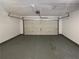 Spacious, unfinished garage with overhead door at 3151 Victoria Place Dr, Loganville, GA 30052