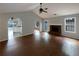 Bright living room featuring hardwood floors, fireplace, and vaulted ceilings at 3151 Victoria Place Dr, Loganville, GA 30052