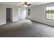 Bedroom featuring neutral colors, soft carpet, and two windows at 3151 Victoria Place Dr, Loganville, GA 30052