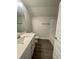 Clean bathroom featuring a single vanity, modern fixtures, and a combination tub and shower at 3392 Milan Ct, Douglasville, GA 30135