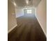 Large bonus room or loft area, featuring plush carpeting and a window with a scenic view, ideal for versatile use at 3392 Milan Ct, Douglasville, GA 30135
