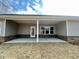 Spacious covered patio with exposed brick accents, great for entertaining or enjoying outdoor living at 3392 Milan Ct, Douglasville, GA 30135