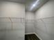 Spacious walk-in closet with ample shelving and storage solutions, perfect for organizing wardrobe and accessories at 3392 Milan Ct, Douglasville, GA 30135