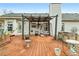 Relaxing back deck featuring a pergola and swing, great for outdoor living at 40 Berkshire Run, Covington, GA 30016
