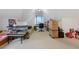 Bonus room with a sloped ceiling, a fish tank, a couch, a desk, and moving boxes at 40 Berkshire Run, Covington, GA 30016