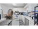 Functional kitchen featuring ample counter space, a dishwasher, and access to the dining area at 40 Berkshire Run, Covington, GA 30016