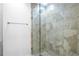 Elegant bathroom highlighting glass shower with tile surround and updated hardware at 1421 Peachtree Ne St # 310, Atlanta, GA 30309